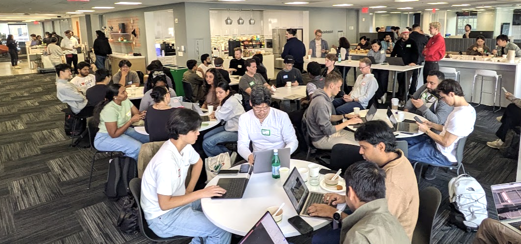 Beautiful CodeRabbit office with many happy Jev hackers